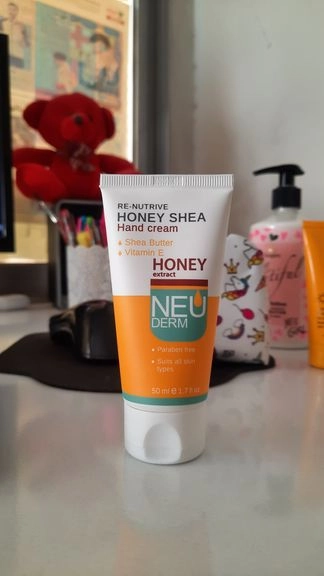 کرم مرطوب کننده نئودرم مدل Re-Nutrive Honey Shea عسل حجم 50 میلی لیتر